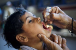 Photo of a boy receiving medicated drops